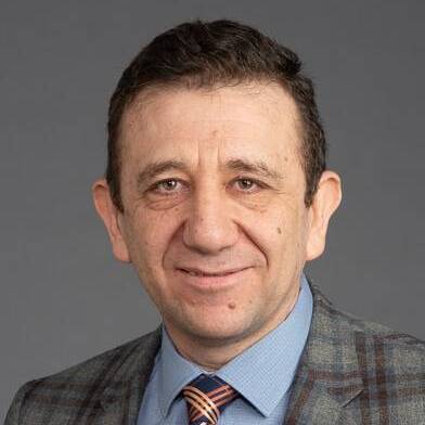 A headshot of Murat Acar, MD